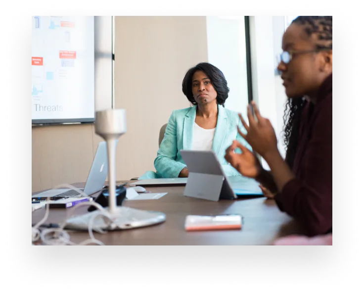 Business leaders reviewing client outcomes